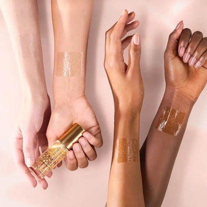 Swatches van Catrice Glam In Gold Hydrating Primer op verschillende huidtinten
