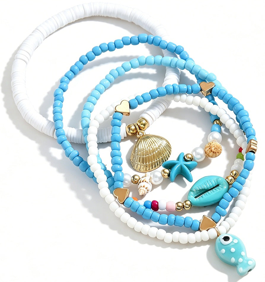 Elastische enkelbandjes met zeester schelp en vis bedel