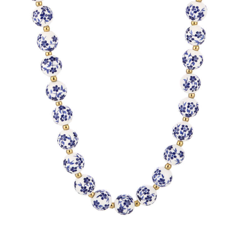 Blauw witte kralenketting met goudkleurige details - Medase