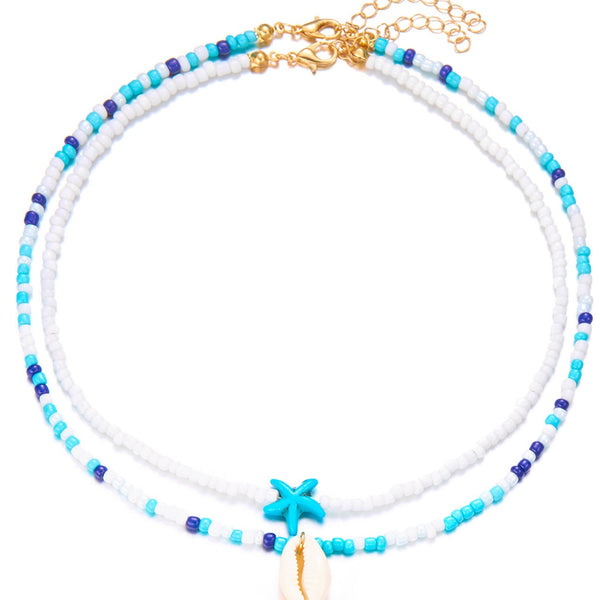 Set van 2 kettingen wit en blauw wit met zeester en schelp - Medase