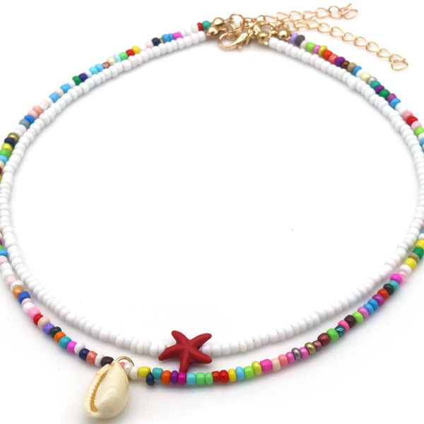 Set van 2 kettingen wit en multicolor met rode zeester en schelp - Medase